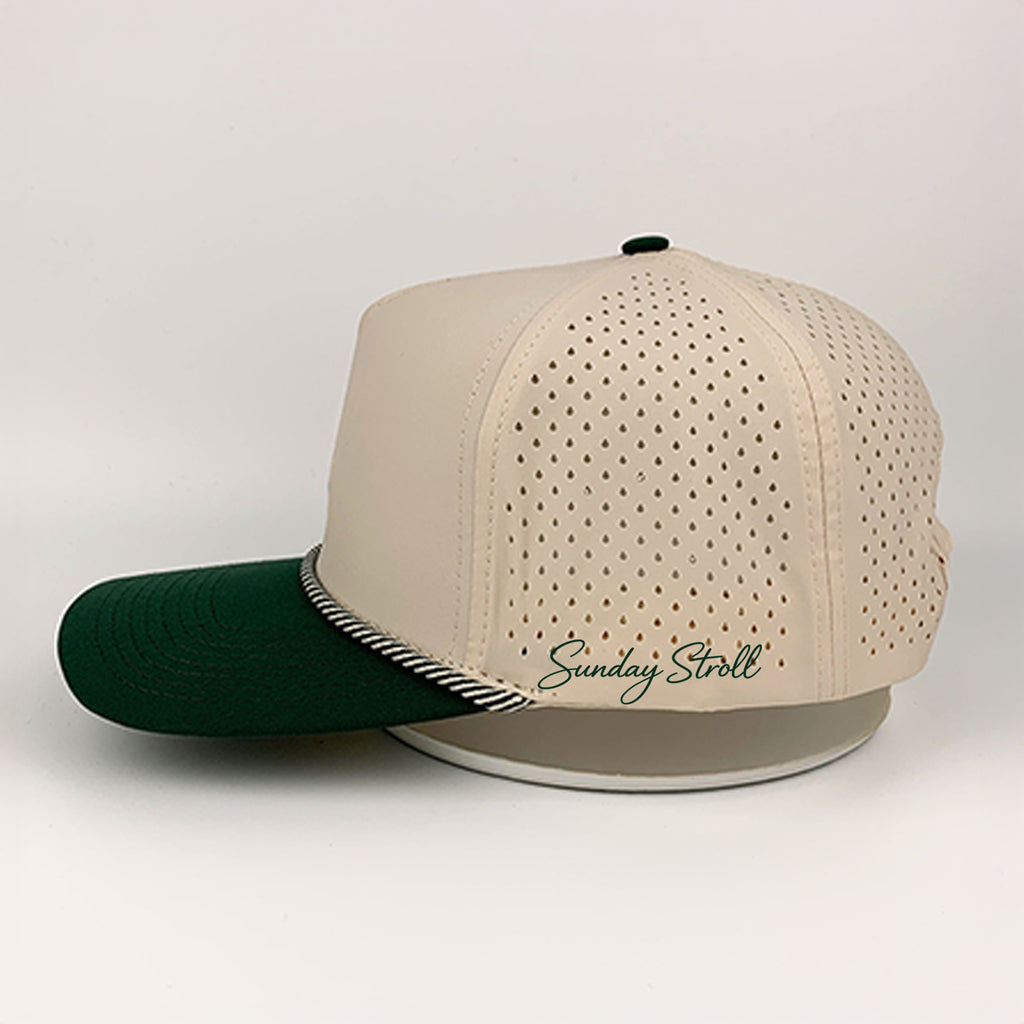Beige and green baseball cap with a brand logo on a white background