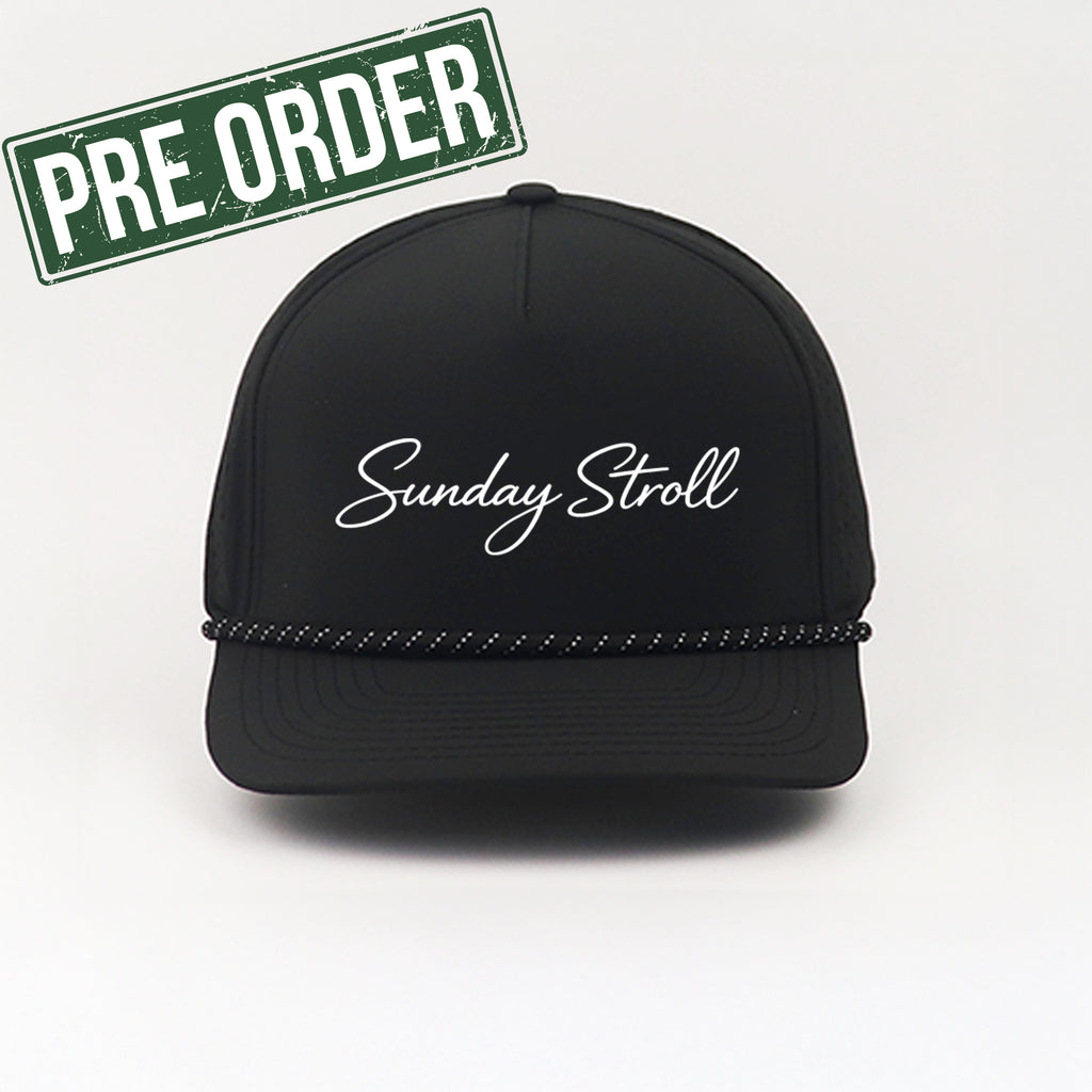 Black cap with 'Sunday Stroll' text on a white background, featuring a 'Pre Order' label.