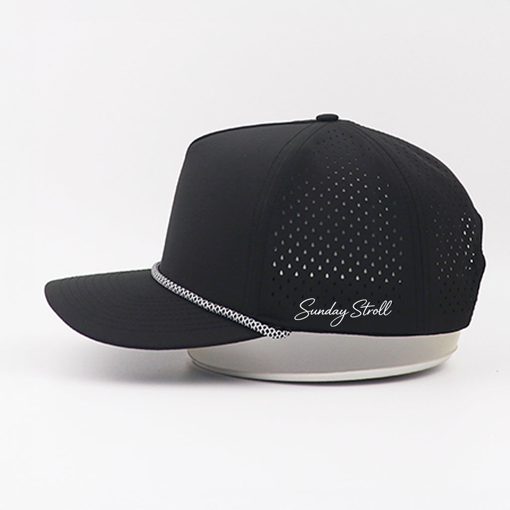 Black cap with 'Sunday Stroll' branding on a white background