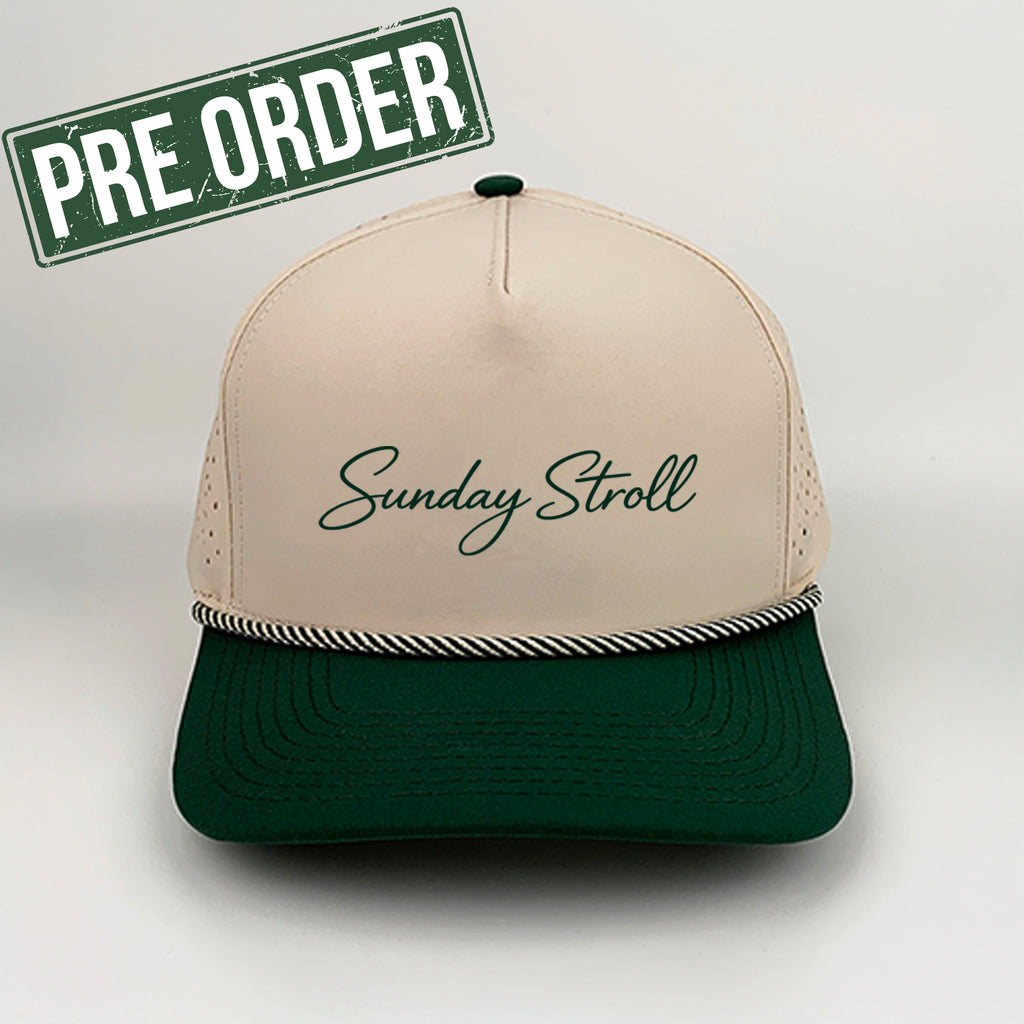 Beige and green cap with 'Sunday Stroll' text on a light gray background, featuring a 'Pre Order' label.