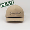 Beige cap with 'Sunday Stroll' text and 'Pre Order' label on a light gray background
